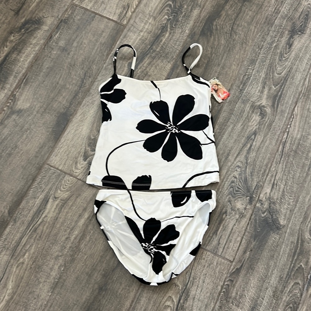 Very flattering black and white tankini swimsuit.